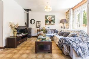 a living room with a couch and a table at Gîte G1255 in Tribehou