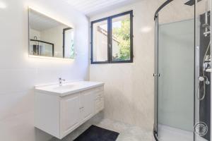 a bathroom with a sink and a shower at Gîte G1255 in Tribehou +12 photos