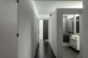 a white bathroom with a sink and a mirror at Fuentes de León in Fuentes de León +8 photos