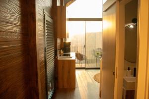 a bathroom with a sink and a window in a room at Casa de Sobreiros in Amarante +67 photos