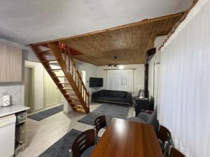 a living room with a table and a couch at Liva Kartal in Karasu