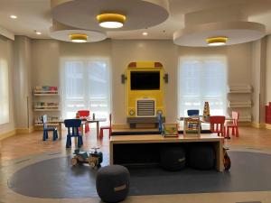 a large room with a play room with a toy truck at Saint Honore - La Casa De Khea in Sampong