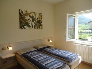 Säng eller sängar i ett rum på Villa Ninfea