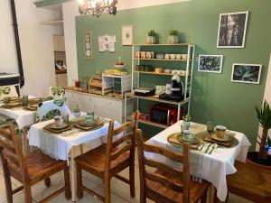a dining room with two tables and chairs at FarAway House B&B in Narni