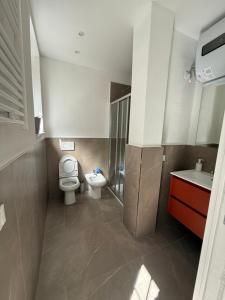 a bathroom with a toilet and a sink at Chiara in Cairo Montenotte