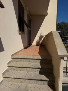a stairway leading up to a building with a window at Balo’s home in Venturina Terme