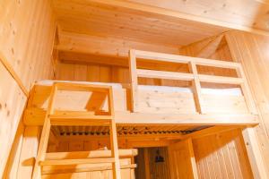 a wooden cabin with two bunk beds in it at Romantisches Berg-Chalet in Bayrischzell