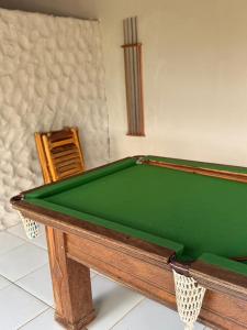 a green pool table in a room at Pousada Du Porto in Macau
