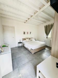 a bedroom with a large bed in a room at Giardini B&B in Modena