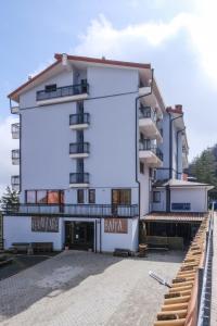 a large white building with a large sign on it at Vista Mare in Sassonetto