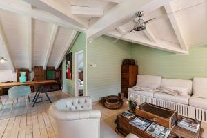 a living room with a bed and a desk at Le Vetrate sul Lago Lake Como Amazing View in Nesso
