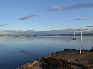 a large body of water with a boat in it at Inzievar in Oakley