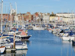 a bunch of boats are docked in a harbor at Newington House in Ramsgate