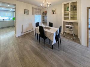 a dining room with a table and chairs at Newington House in Ramsgate
