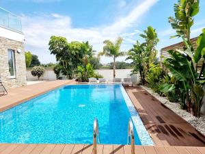 a swimming pool in the backyard of a house at luxury villa utopia 2 in Paphos