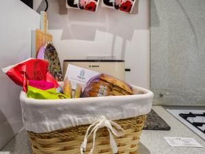a basket of bread on a counter in a kitchen at Spire View Cottage in Olney +5 photos