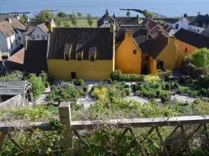 a view of a village with a garden at Lime Tree Cottage in Oakley