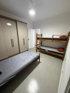 a bedroom with two bunk beds in a room at chácara 3A-2 in Pôrto Feliz +9 photos