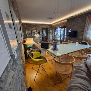 a dining room with a table and chairs at 7 Roots - Leskovik in Leskovik +14 photos