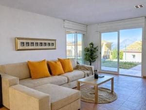 a living room with a couch and a table at Casa Relax in Polop - Jacuzzi and Pool in Polop