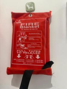 a red bag of dog food hanging on a wall at رفاه الماسي in Medina