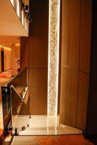 a lobby with a staircase in a building at AQMYRZA Inn in Zharkent +96 photos