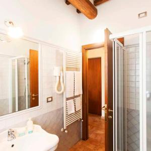 a bathroom with a sink and a mirror at B&B Le Cascatelle di Saturnia in Saturnia
