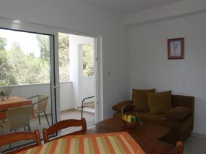 a living room with a couch and a table at Vanda Seafront Fantastic in Cavtat