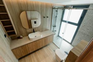 a bathroom with a sink and a mirror at Aetheria South in Kourouta +48 photos