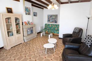 a living room with a couch and a table at location Vakañsoù in Lanouée