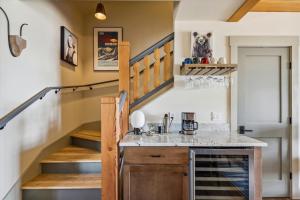 a kitchen with a staircase in a house at TrappHof in Stowe Fork +28 photos