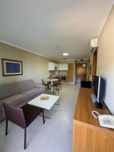 a living room with a couch and a table at Darkin 10 in Strožanac