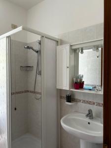 a bathroom with a shower and a sink at Da Davide in Marciana Marina +8 photos