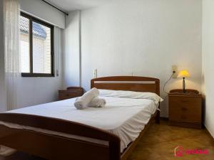 a bedroom with a bed with a towel on it at Poble Mar 7 in Oropesa del Mar