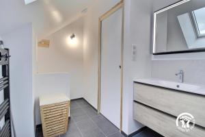 a bathroom with a sink and a mirror at La casa de silz in Arzal +31 photos