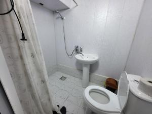 a bathroom with a toilet and a sink at Bobo Haydar FREE LONDRY SERVICE in Bukhara