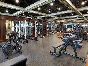 a gym with several treadmills and machines at Grand Mercure Imperial Palace Seoul Gangnam in Seoul