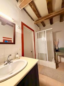 a bathroom with a sink and a mirror at Aux Ecuries du Signe in Amboise +26 photos