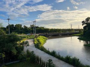 a body of water with a train on it at SafeHouse resort เซฟเฮ้าท์รีสอร์ท in Ban Laem Phai +11 photos