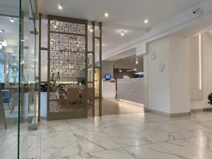 a lobby with a glass door in a building at River Stone in Pavlodar