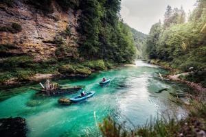 two people in boats on a river in a canyon at Bergliesal in Wildalpen