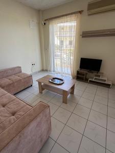 a living room with a couch and a coffee table at Luxury Beach House 2 in Xiropigado