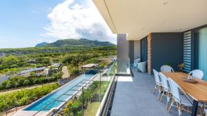 a balcony with a view of a mountain at Panoramic View Mauritius in Ruisseau Créole