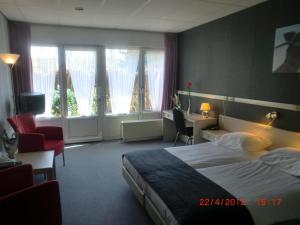 Кровать или кровати в номере Hotel Restaurant Boschlust