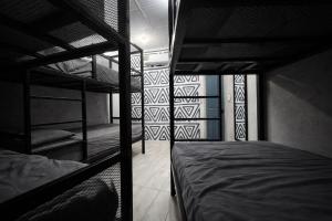 a room with two bunk beds in it at OyeBonita Hostel in Panama City