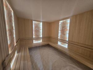 a empty room with two windows and a pool of water at Maribel Spa Hotel in Köprilova +61 photos