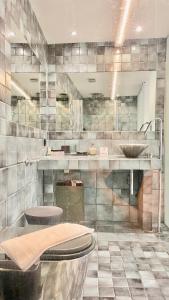 a bathroom with a sink and a toilet at Faro Apartments in Chania +51 photos