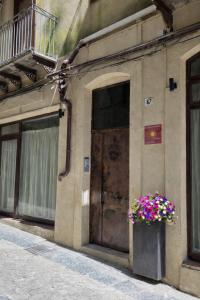 a door to a building with a flower box on it at Al Piccolo Cassaro in Caltanissetta