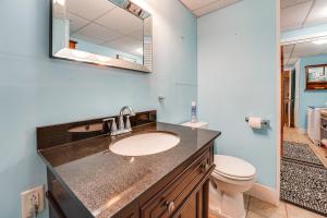 a bathroom with a sink and a toilet and a mirror at 3 Mi to Bath Historic District! Stylish Studio in Harding