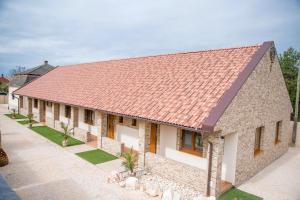 an overhead view of a house with a red roof at La Palma Gúta in Kolárovo